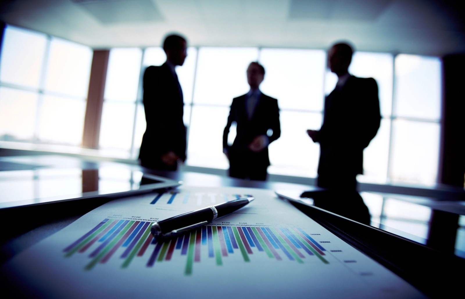 This image shows three businessmen we're having discussion.